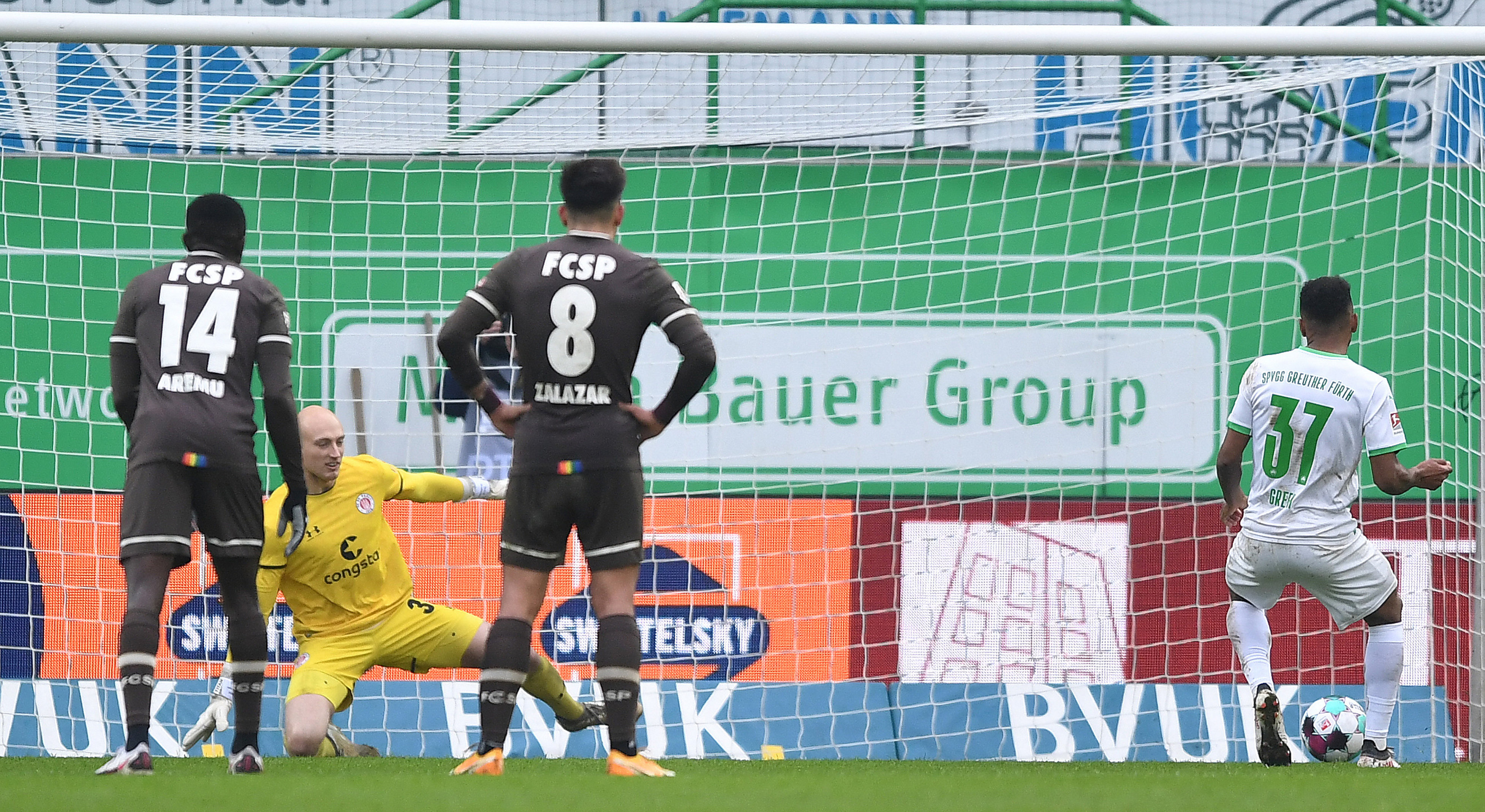 Julian Green slots a penalty into the bottom-right corner to give Fürth the lead.