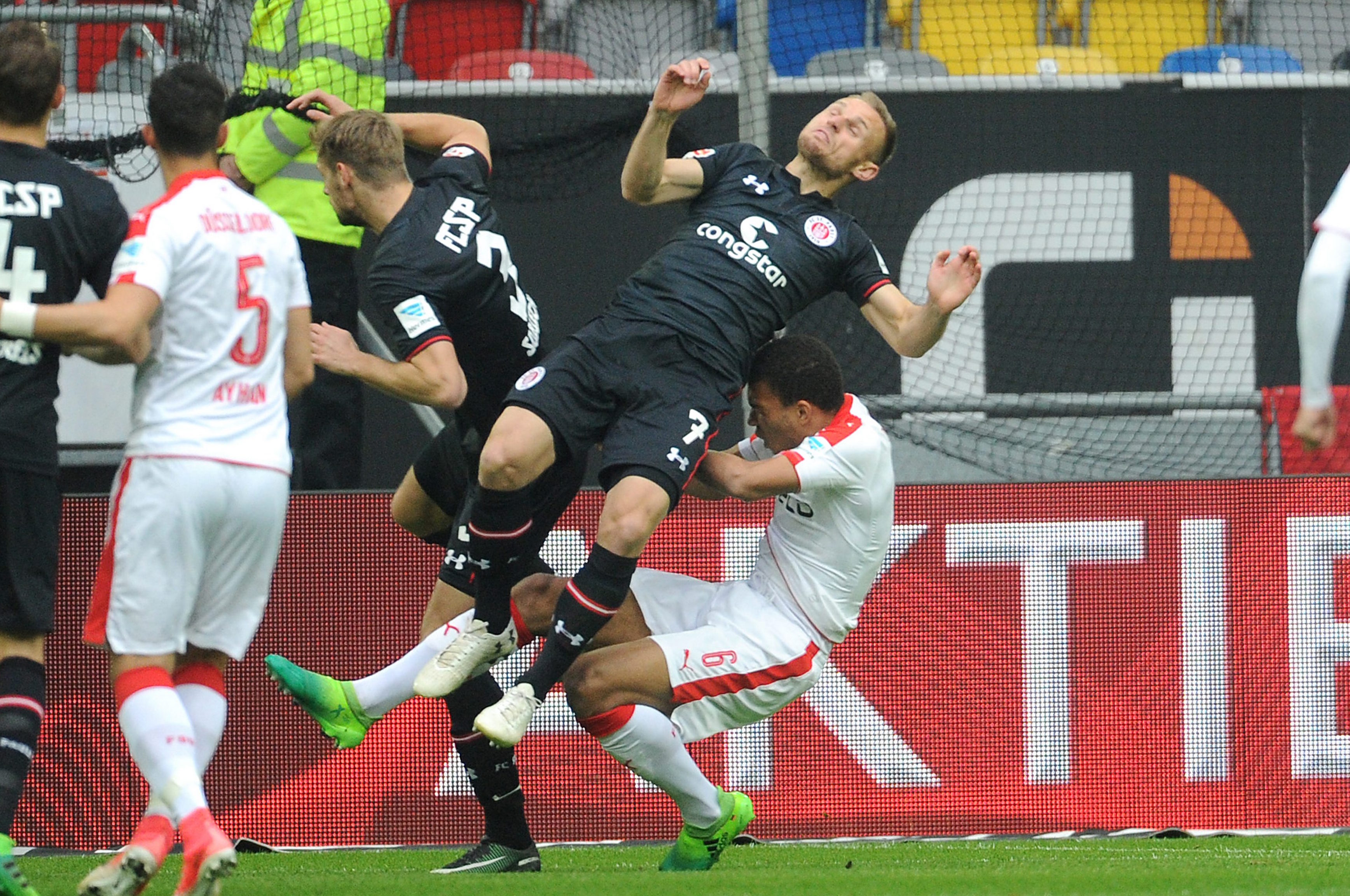 Awful scene early on: Bernd Nehrig and Düsseldorf's Kevin Akpoguma clattered into each other and were taken to hospital, where the Fortuna defender was diagnosed with a C1 vertebra fracture.